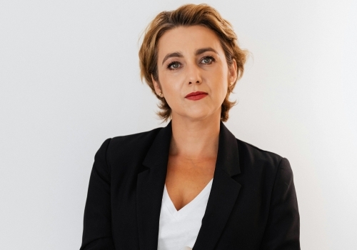 A professional woman with a serious look on her face.